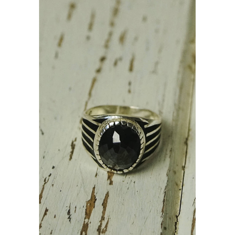Antique silver ring with oval black stone